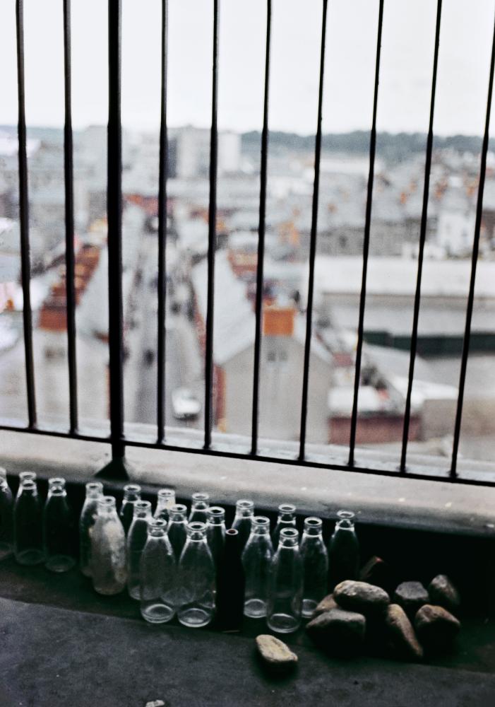 Emptied milk bottles and rocks ahead of riots, Rossville Flats, the Bogside area, Derry, Northern Ireland, c1969.