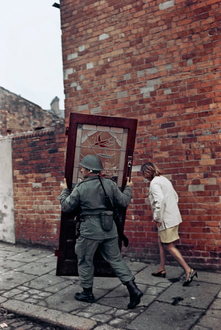 ‘A strange poetry’: British soldier carrying a door, Bombay Street, west Belfast, 1969.
